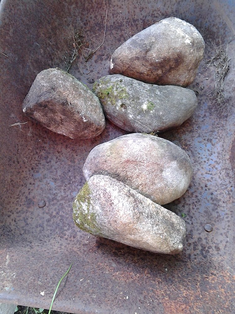 Rocks inside of a wheelbarrow