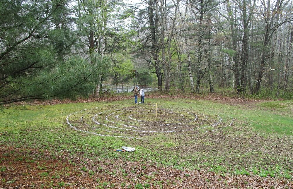 Sand is being laid out for the outline of the labyrinth